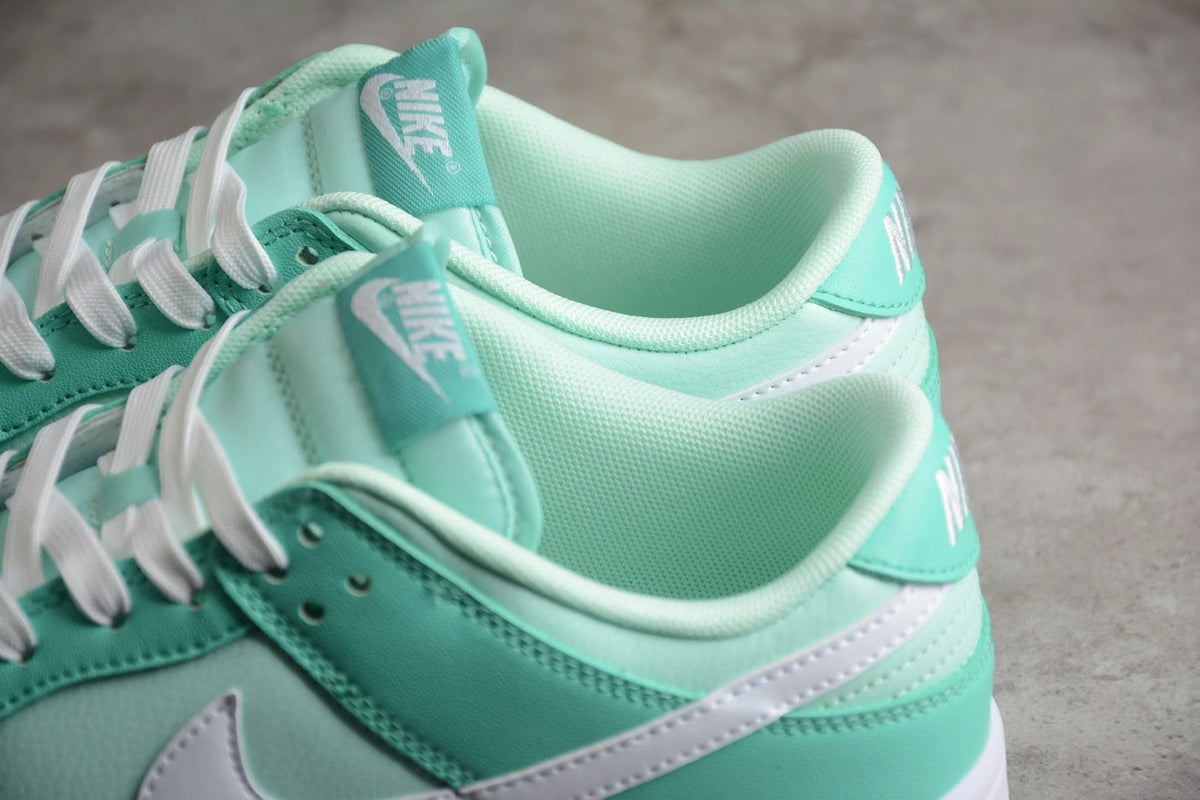 Close-up view of the mint green padded collars, tongues, laces, and heel panels.