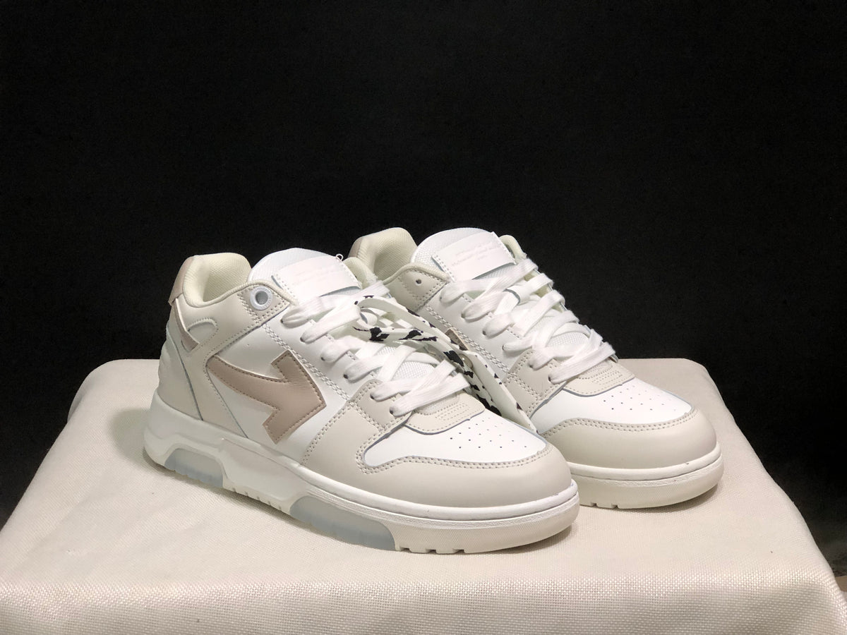 Front three-quarter view of the white sneaker pair with perforated toe boxes, laces, and contrasting side graphics.