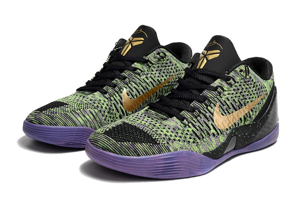 Pair of black, green, and purple low-top shoes shown from the front.