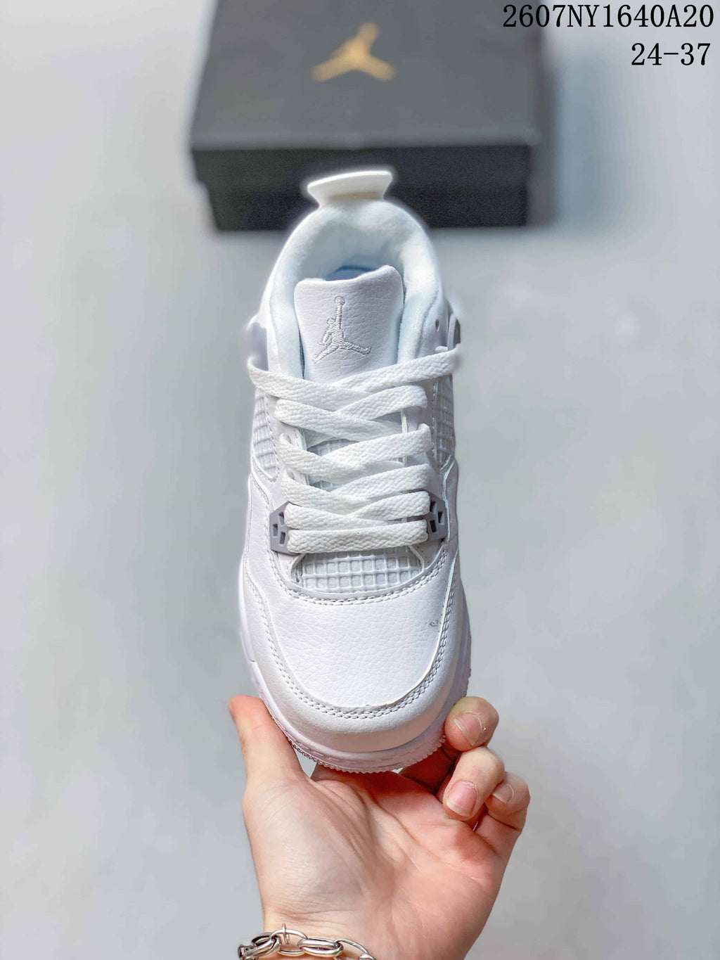 Top view showing the white laces, padded tongue, toe box, and mesh-style tongue and eyestay panels.