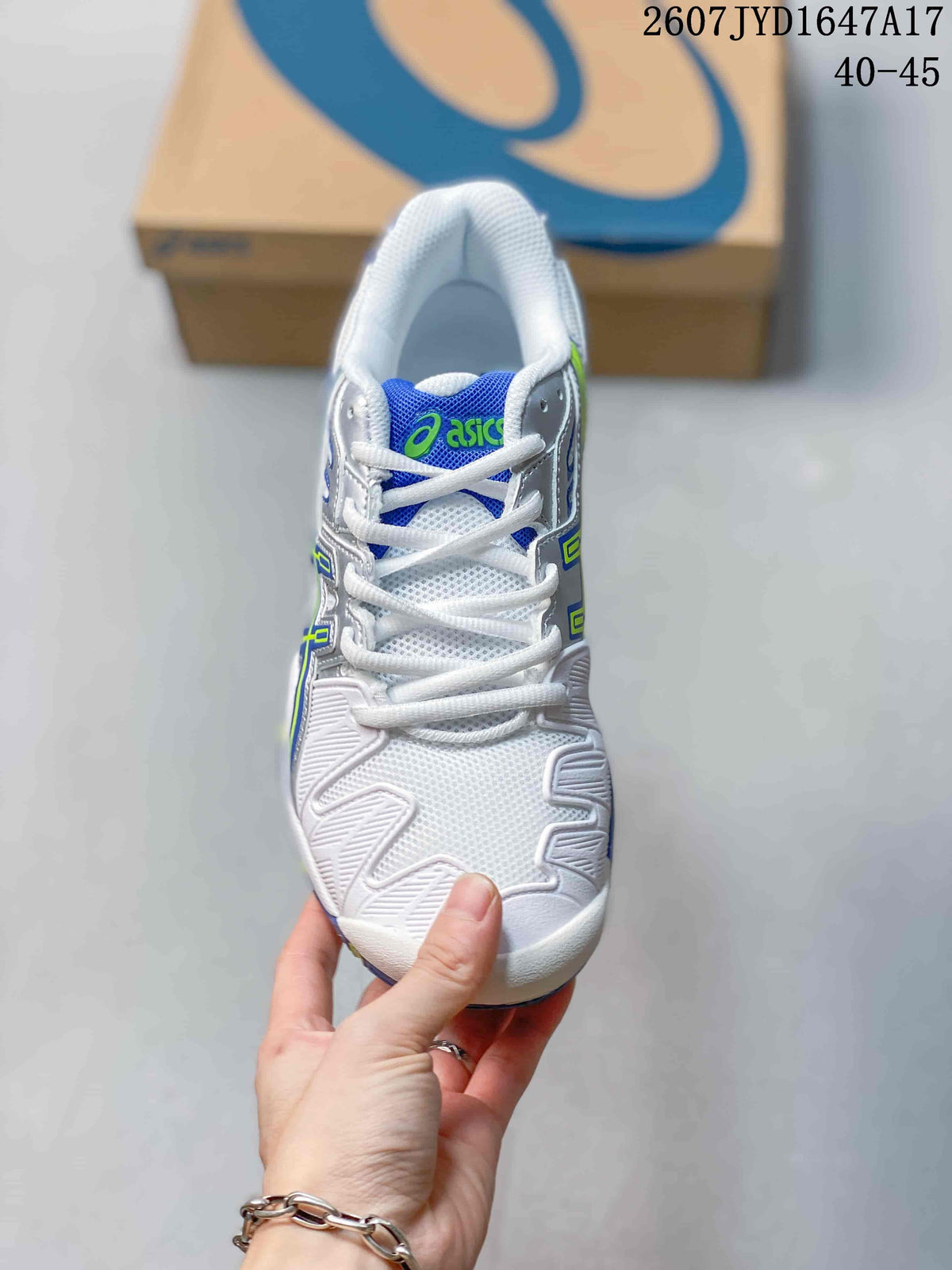 Top view of the white lace-up tennis shoe with a blue tongue, green ASICS branding and textured toe panels.