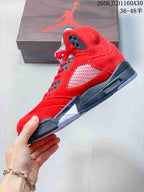Side view of the red high-top sneaker showing its mesh panel and dark midsole.