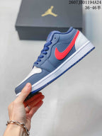 Side profile showing the navy upper, red side branding, white midsole, and navy outsole.