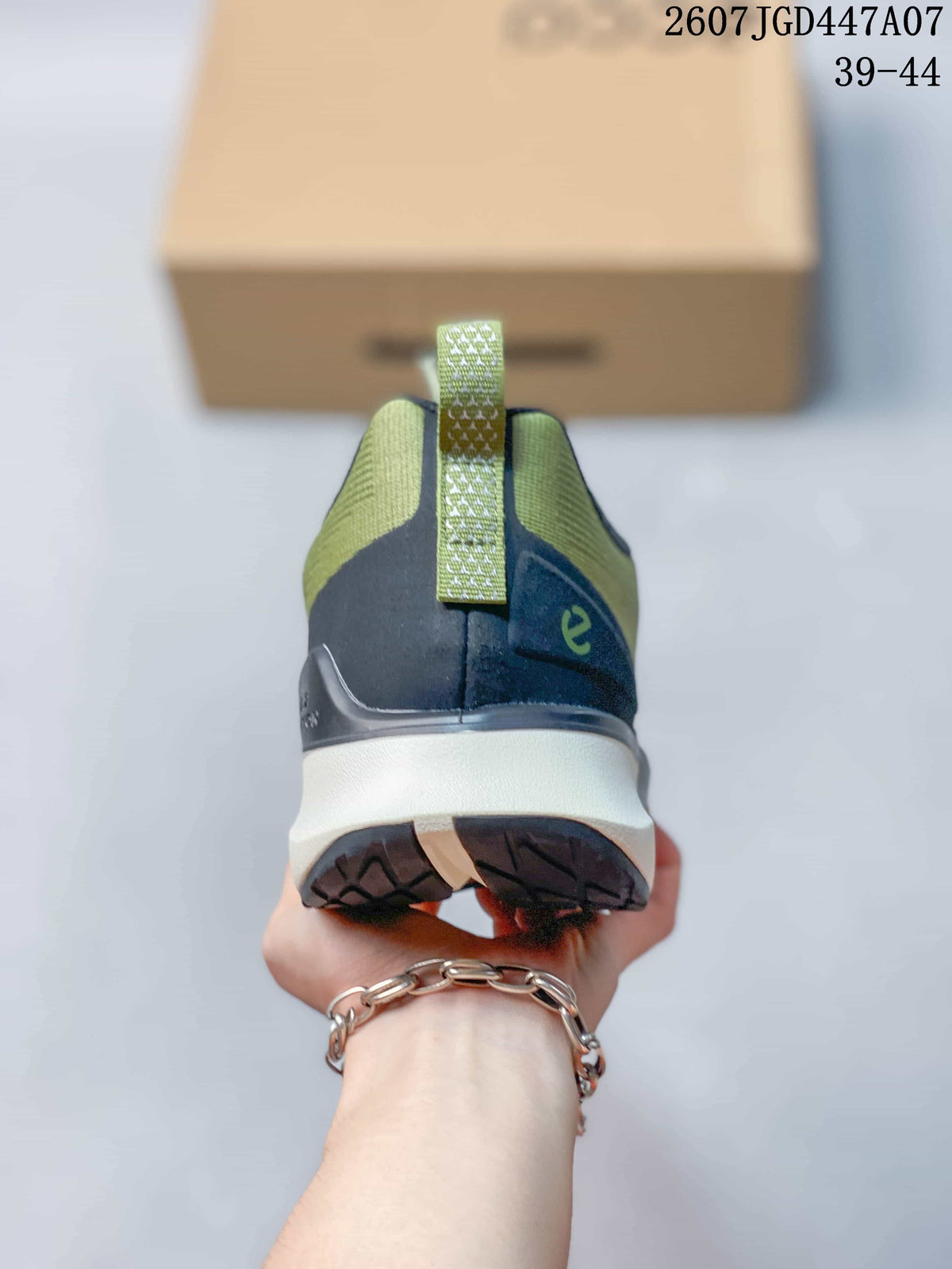 Rear view of the sneaker showing the heel pull tab, padded collar, layered heel construction, and dark outsole.