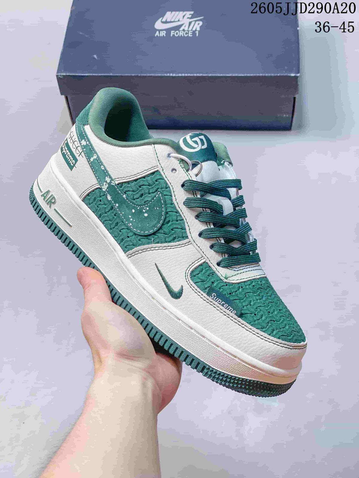 Close-up of a white and green Nike Air Force 1-style sneaker with textured green panels, green laces and a green outsole.
