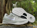 Pair of Wolf Grey Nike Kobe 8 shoes, including a view of the patterned outsole