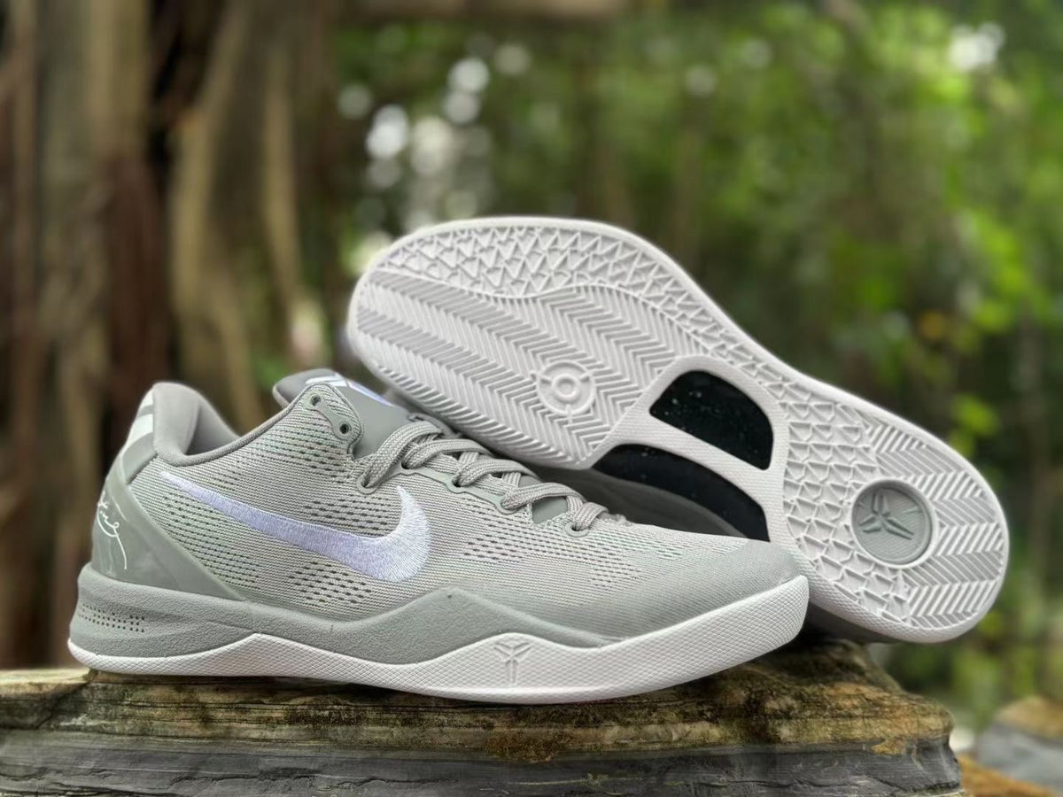 Pair of Wolf Grey Nike Kobe 8 shoes, including a view of the patterned outsole