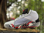 Angled side view showing the white upper, patterned side panel, and red and black details.