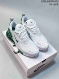 White and green Nike Air Max 270 Premium sneakers on a shoe box
