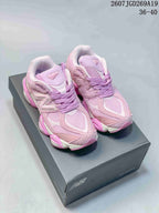 Pair of pink and lilac New Balance 9060 sneakers shown on a shoebox, with the listed size range 36–40 visible in the upper-right corner.