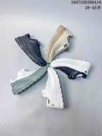 Group display of DESCENTE low-top sneakers in black, beige, pale green, white and black-white colorways; source overlay shows product code 2607GDD386A16 and size notation 38–45 with half sizes.