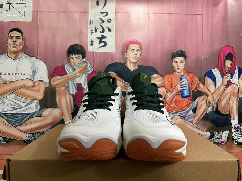 Front view of the white Mizuno Wave Momentum 3 shoes showing dark green laces and gum-colored toe sections