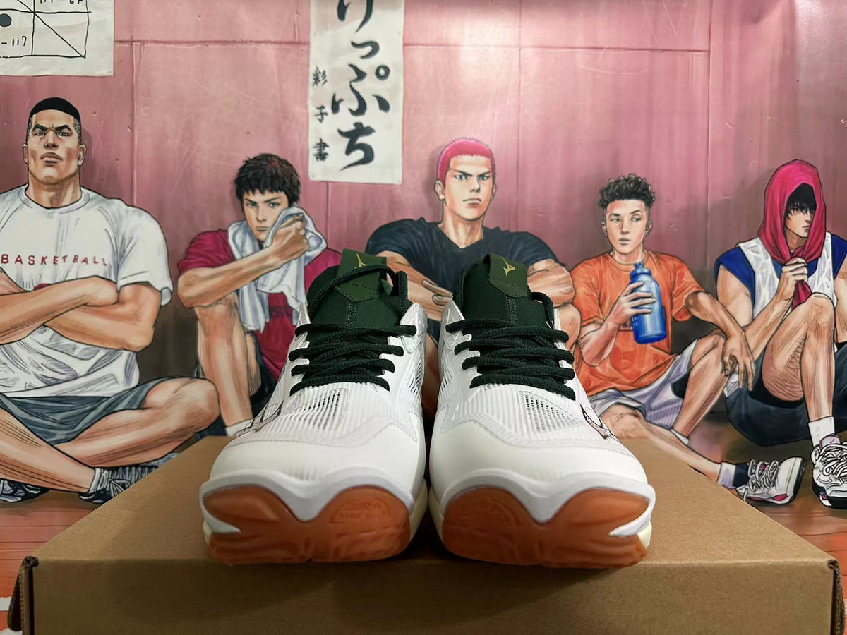 Front view of the white Mizuno Wave Momentum 3 shoes showing dark green laces and gum-colored toe sections