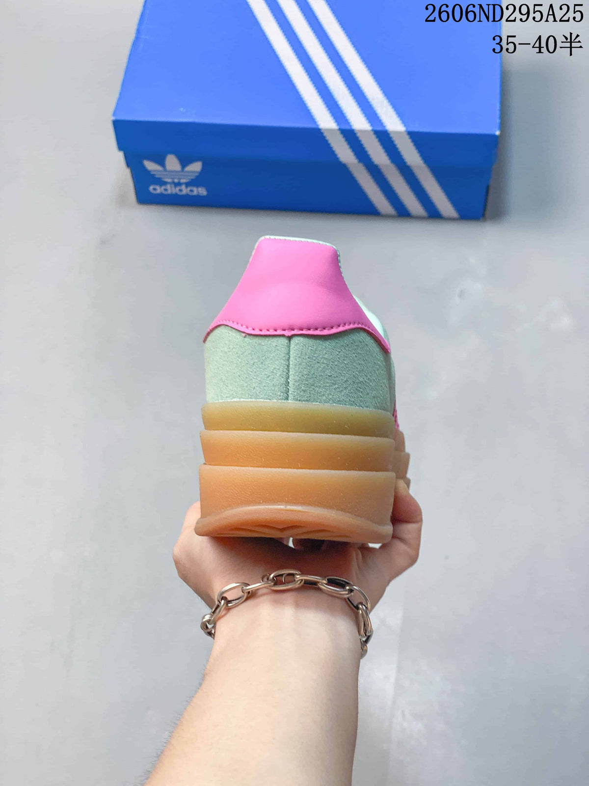Rear view showing the padded pink heel detail and layered gum-colored platform outsole.