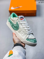 Off-white Nike Blazer Low ’77 Jumbo sneaker with green textured accents