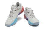Pair of light gray Adidas Adizero shoes with blue, purple and coral sole accents