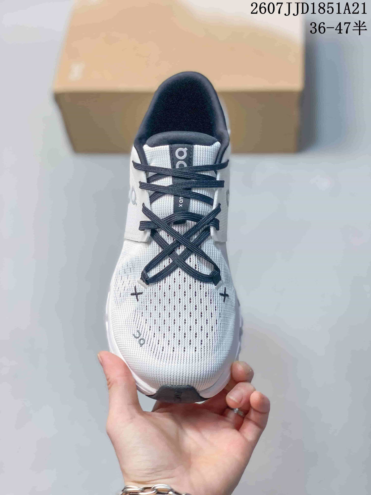 Top view of the sneaker showing the perforated forefoot, dark laces, padded tongue, and contrasting details.