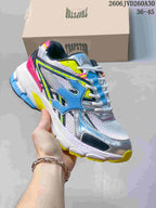 White, silver, blue, yellow, and pink Trapstar Trispeed 3000 sneaker.