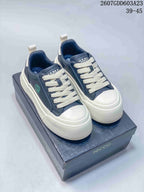 Pair of navy and white ECCO sneakers displayed on a branded shoe box; code 2607GDD603A23 and size range 39–45 are visible.