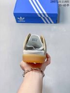 Rear view of a sneaker with a gum-colored sole