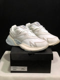 Pair of white and light grey AMIRI MA Runner sneakers displayed on a black shoebox labeled size 41.