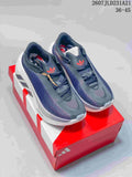 Pair of dark navy and white Adidas Hyperboost EDGE sneakers displayed on a red Adidas shoebox.