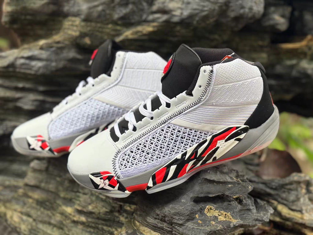 Close angled view of both shoes highlighting the lattice-patterned side panels and contrast graphics.