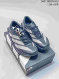 Pair of dark gray and white adidas Adizero Evo SL 2 running shoes displayed on a shoebox.