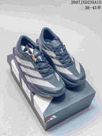 Pair of dark gray and white adidas Adizero Evo SL 2 running shoes displayed on a shoebox.