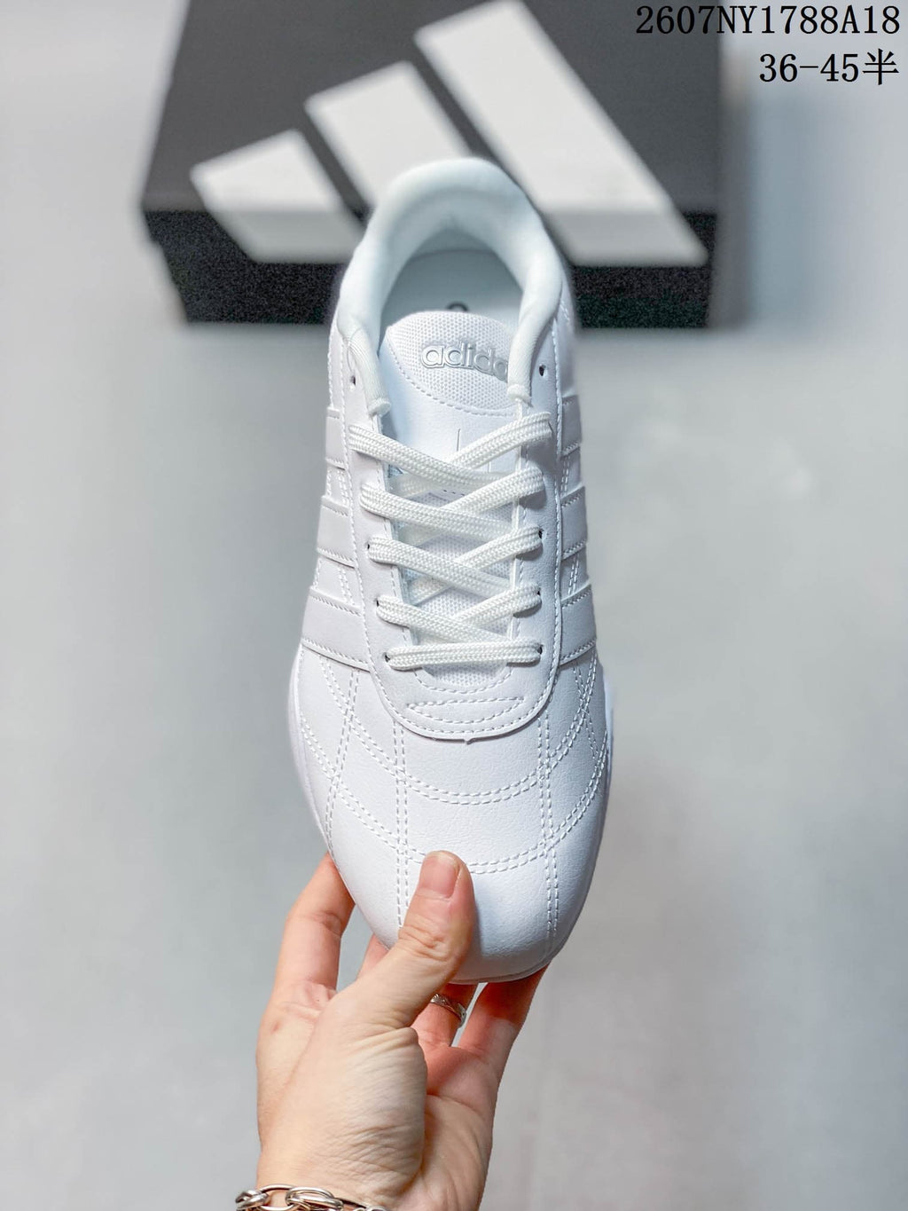 Top view showing the white laces, tongue branding and stitched toe detailing.