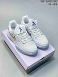 Pair of white Nike JA 2 EP basketball shoes with multicolor speckling, yellow side accents, and a shoe box behind them.