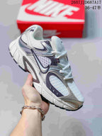 White Nike V5 RNR sneaker with dark gray and burgundy accent panels.