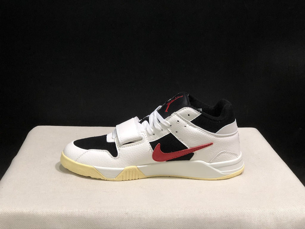 Full side profile of one high-top sneaker showing the strap, red side branding, and layered outsole.