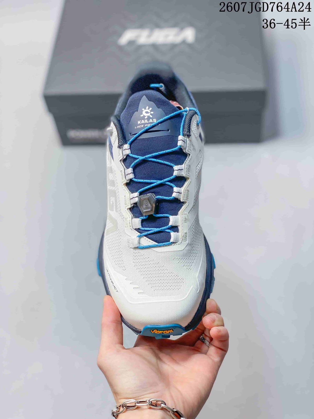 Top view showing the white toe box, navy tongue, blue laces and lace-lock component.
