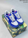 Pair of blue and white BAPE STA low-top sneakers displayed on a camouflage-patterned box; source image shows the reference 2607JGD677A27 and size range 36–46.5.