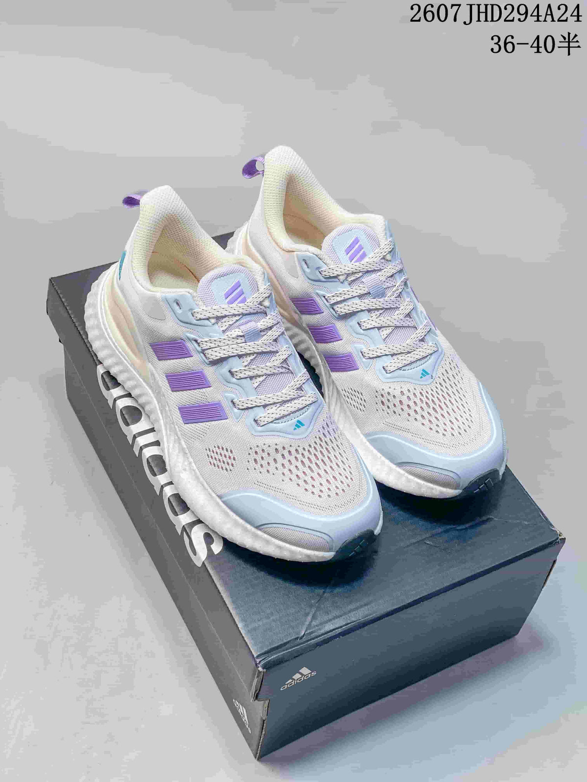 Pair of white adidas Switch FWD sneakers with lilac and light blue accents, displayed on an adidas shoe box.