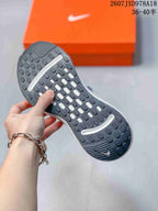 Close view of the Nike Journey Run rubber outsole showing its textured traction pattern and curved white inserts.