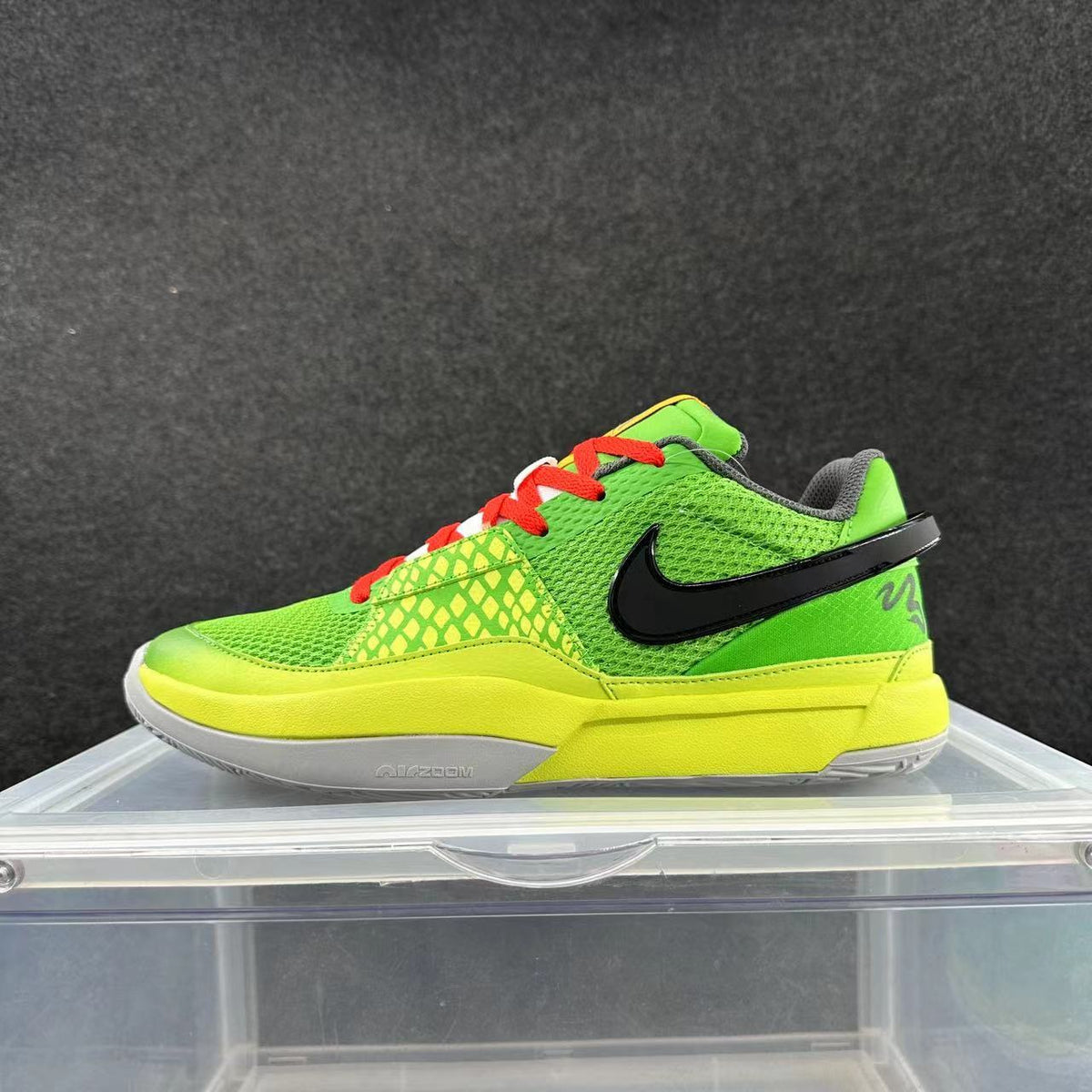 Side view of a bright green low-top Nike sneaker with a yellow midsole, black side logo, red laces, and white outsole section.