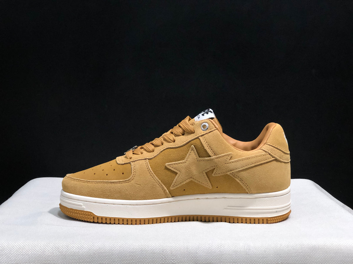 Full side profile showing the low-top construction, tonal side star and layered white midsole.