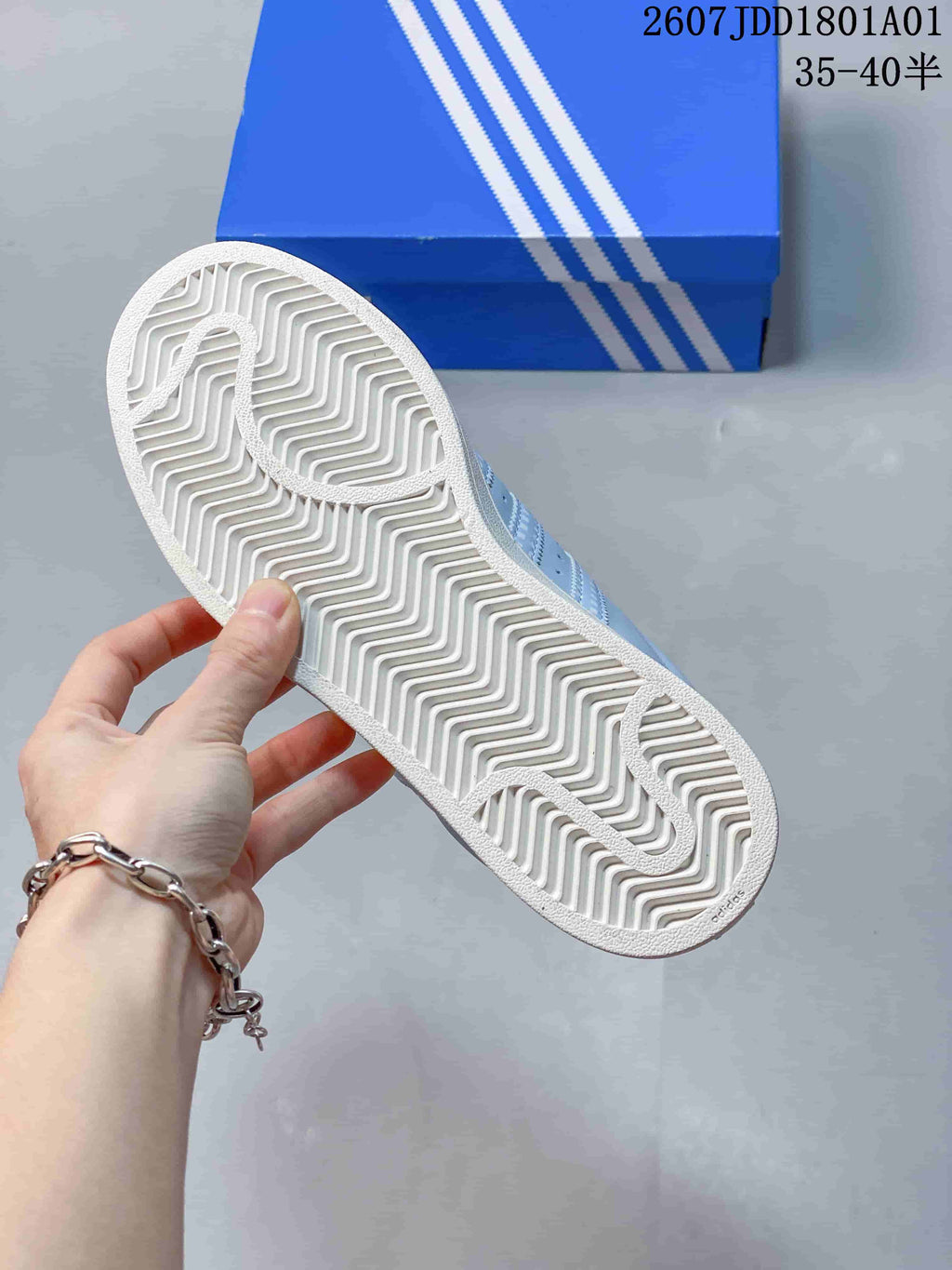 Underside of the Adidas Superstar sneaker showing a patterned white outsole