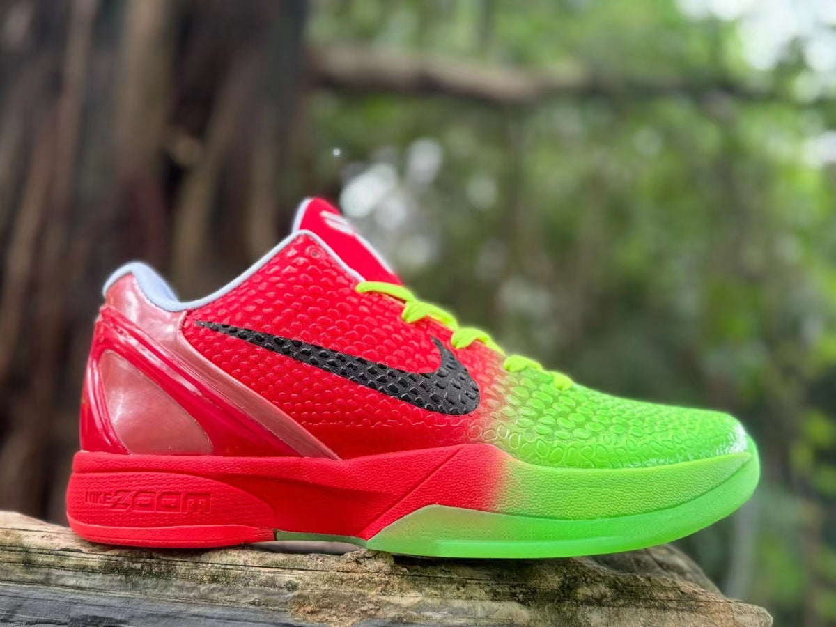 Side profile of a red and green basketball shoe with translucent-looking heel detail