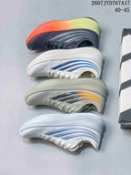 Four Adidas sneaker colorways arranged side by side, including white-blue, light gray-orange, and dark gray-orange-lime combinations.