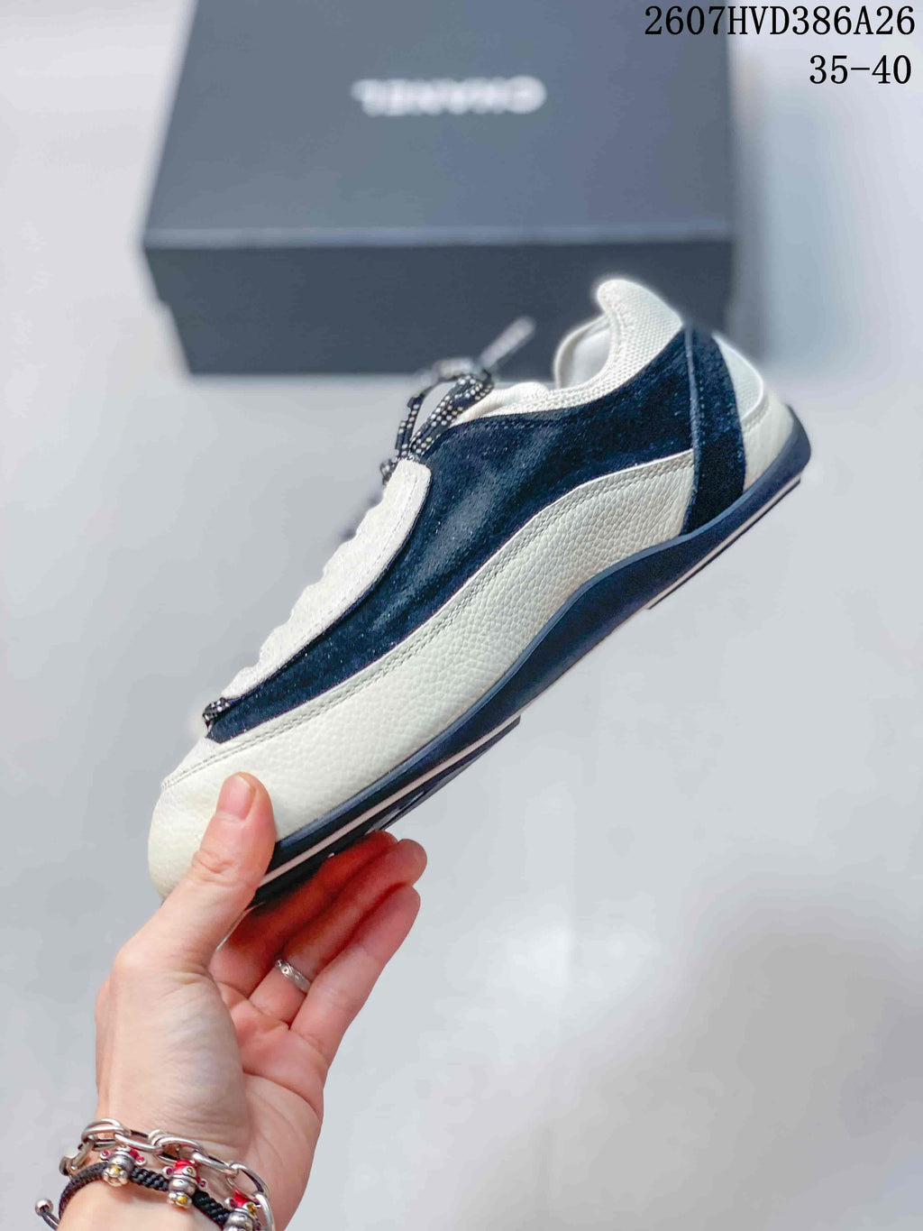 Side profile showing the low-top shape, contrasting panels and layered outsole.