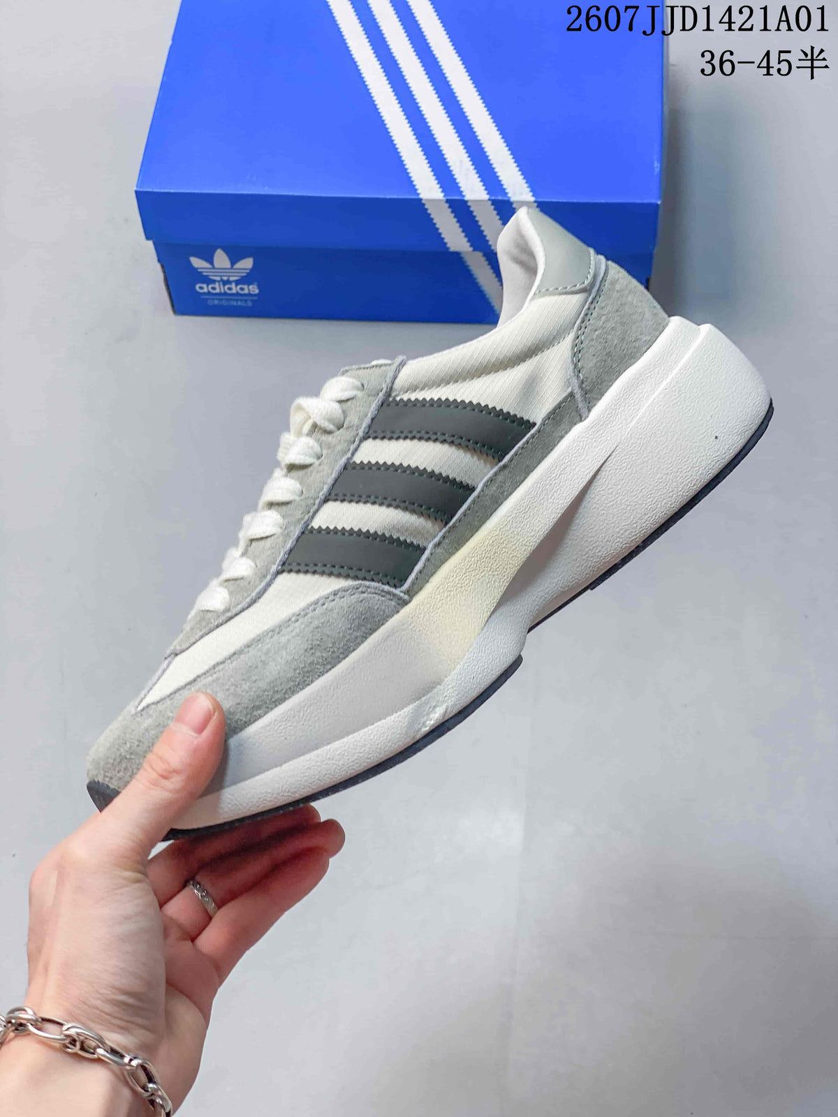 Side profile of the Adidas Adizero SL 72 Pro in off-white and grey