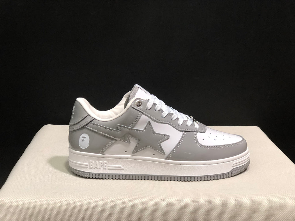 Single side profile highlighting the grey star panel, white midsole and textured grey outsole.
