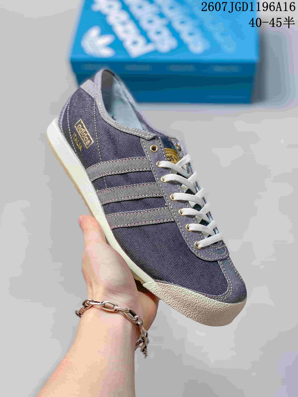 Angled side view showing the low-top silhouette, three-stripe details, contrasting toe cap, and gum outsole.