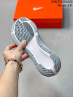 Underside view of a white and gray sneaker showing the patterned outsole and molded sole details; image text shows size range 36–48.5.