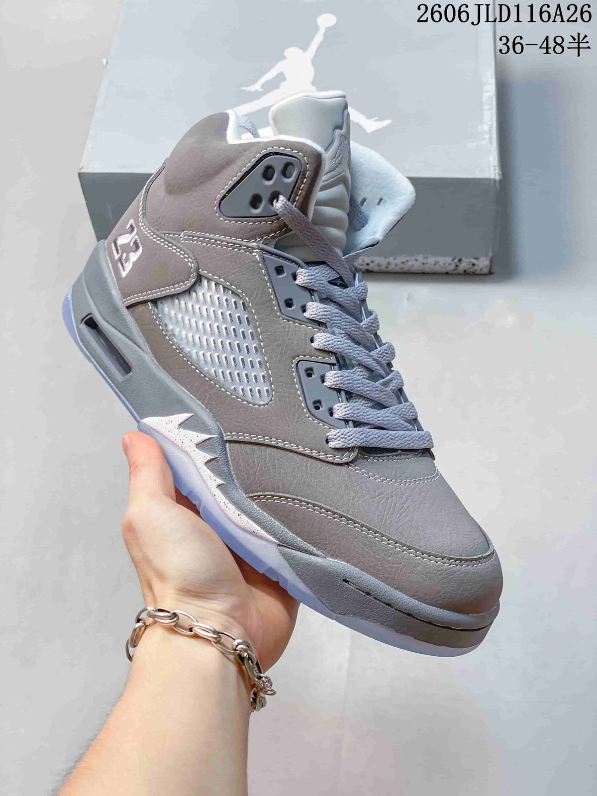 Angled side view showing the details of a grey Jordan Air Jordan 5 sneaker