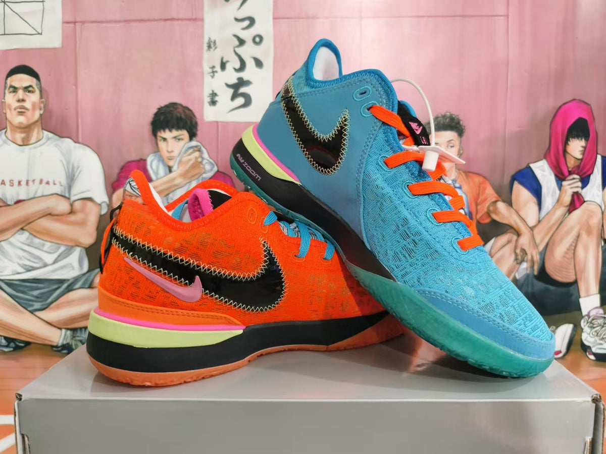 Angled view of the orange and blue shoes, showing their contrasting colors, side Swooshes, and soles.