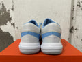 Rear view of white and blue Nike basketball shoes